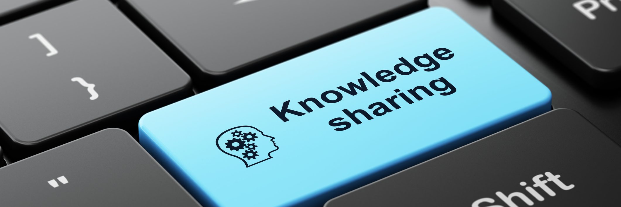 Education concept: Head Gears and Knowledge Sharing on keyboard